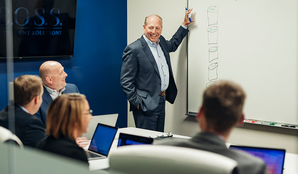 Ryan and Tyson Thacker in a meeting with other BOSS Team Members