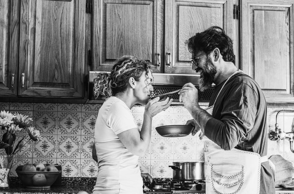 Retired couple cooking together
