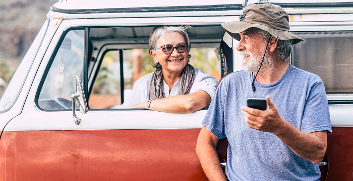 Retired couple on a trip in their 1970's Volkswagen van