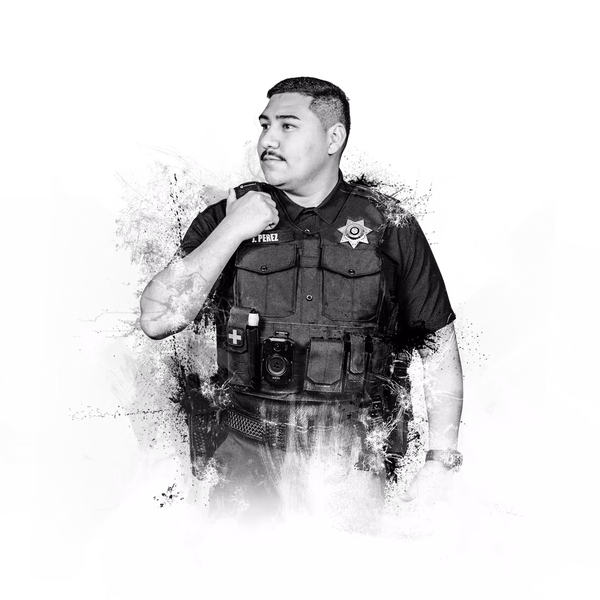Black-and-white image of a police officer with body camera and gear, looking to his left.