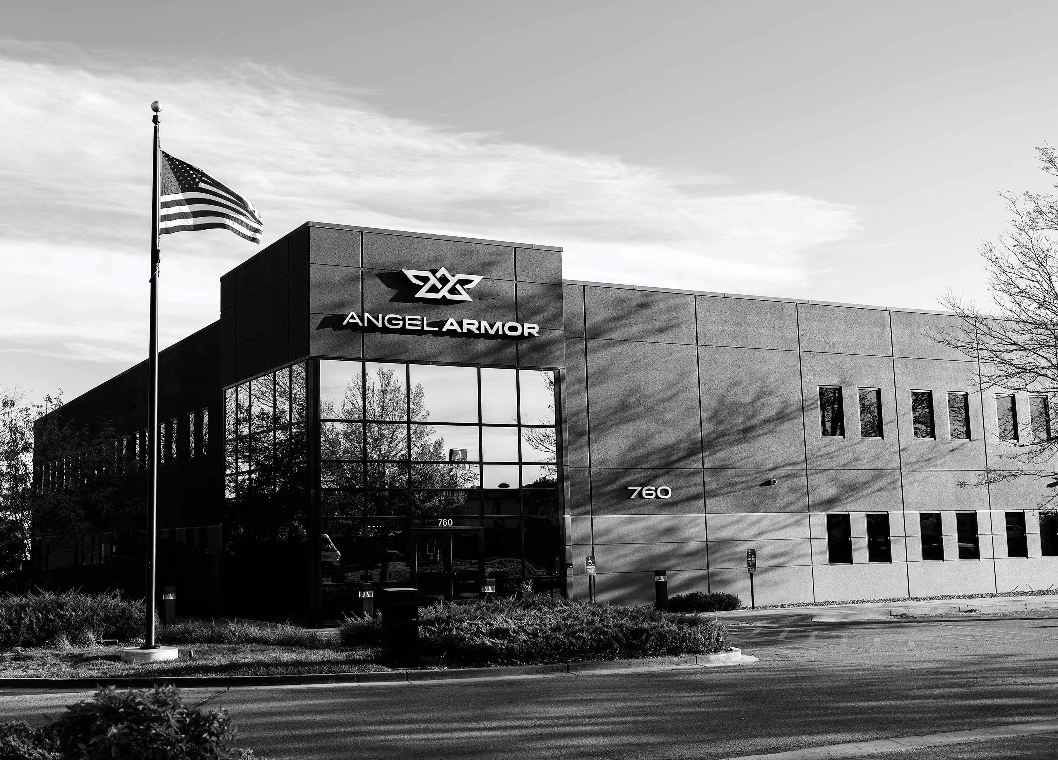 Office building with Angel Armor logo, American flag on pole, and address number 760 visible.