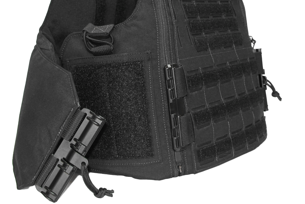 Close-up of a black tactical vest with Velcro patches and buckle fasteners on a white background.