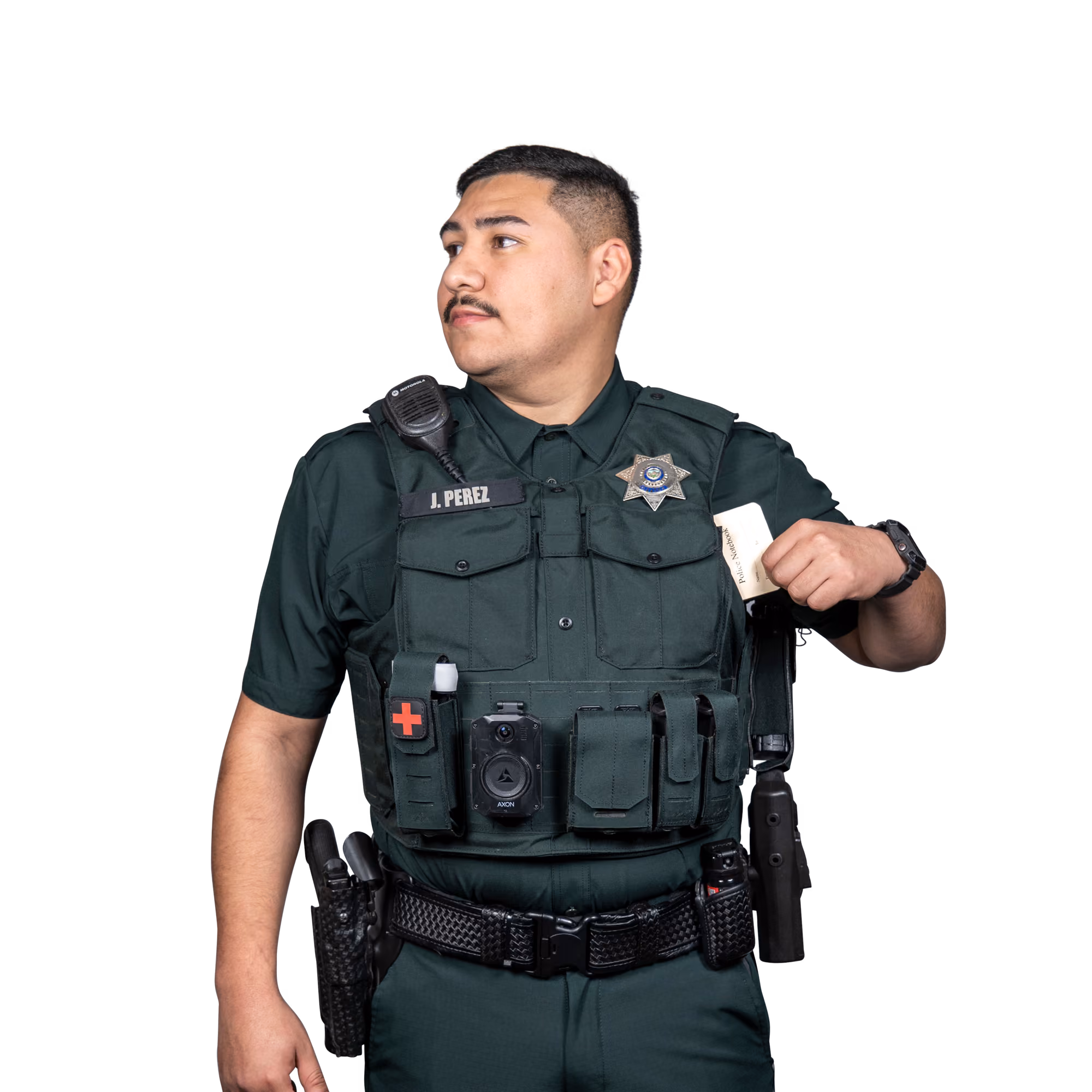 Police officer in uniform with name tag J. Perez holding a police notebook in his vest pocket.