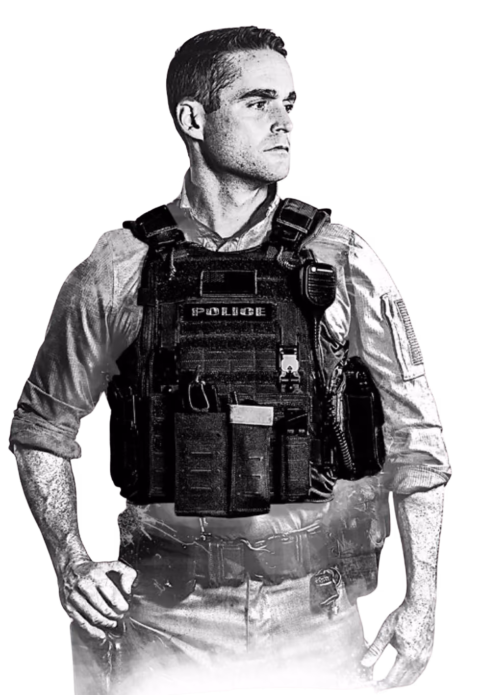 Black and white image of a police officer wearing tactical vest and looking to the side.