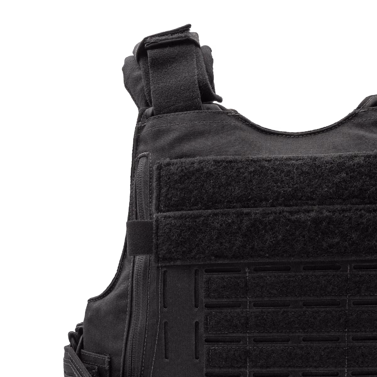 Close-up of black tactical vest with velcro straps and attachment points on front panel.