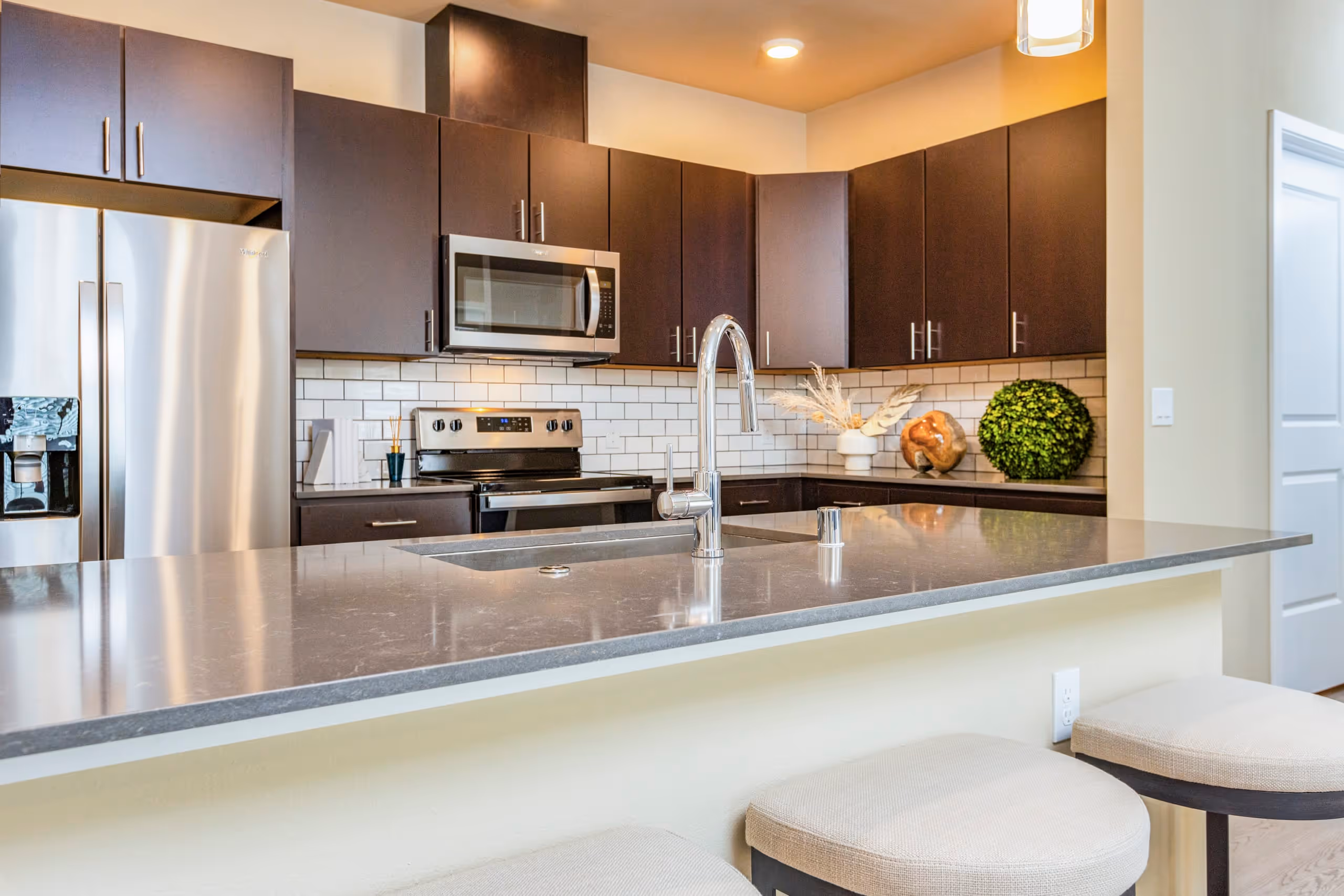 Luxury Kitchen with brown cabinets l Anchor 532 Apartments in Vallejo, CA 