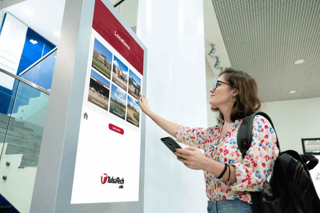 A woman interacts with digital signage