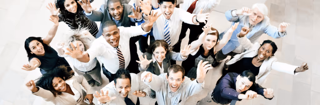 Diverse group of employees celebrating successful adoption of sustainable travel practices in the workplace.