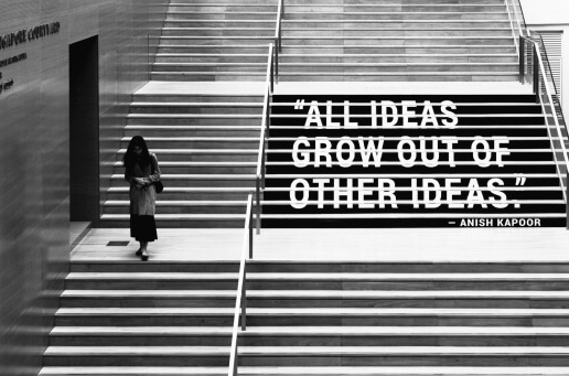 Black and white picture of a girl walking up the stairs