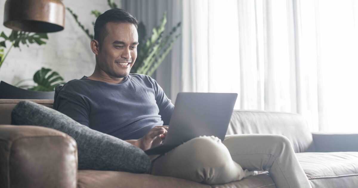 Guy typing on the laptop