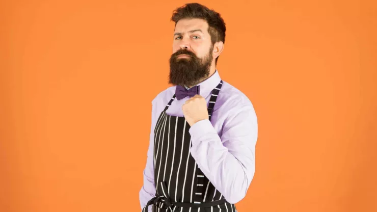 A man with apron and bow tie