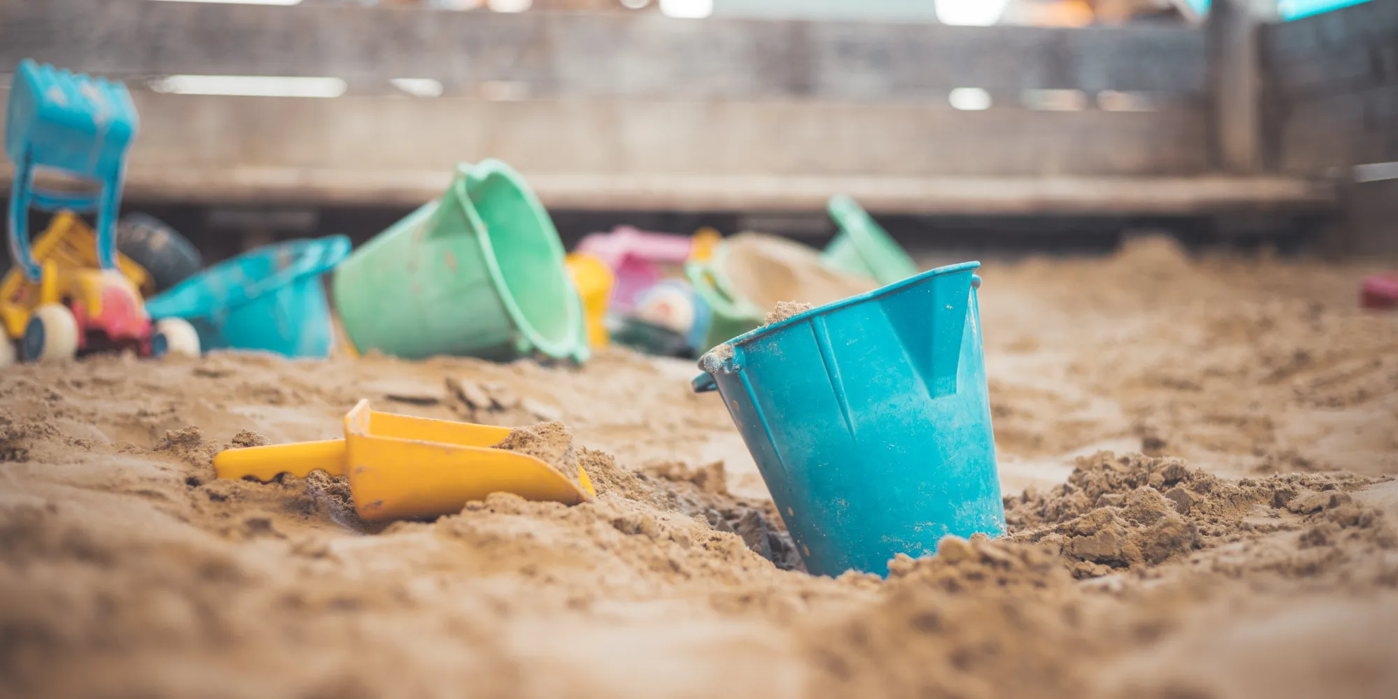 Sandbox with blue bucket