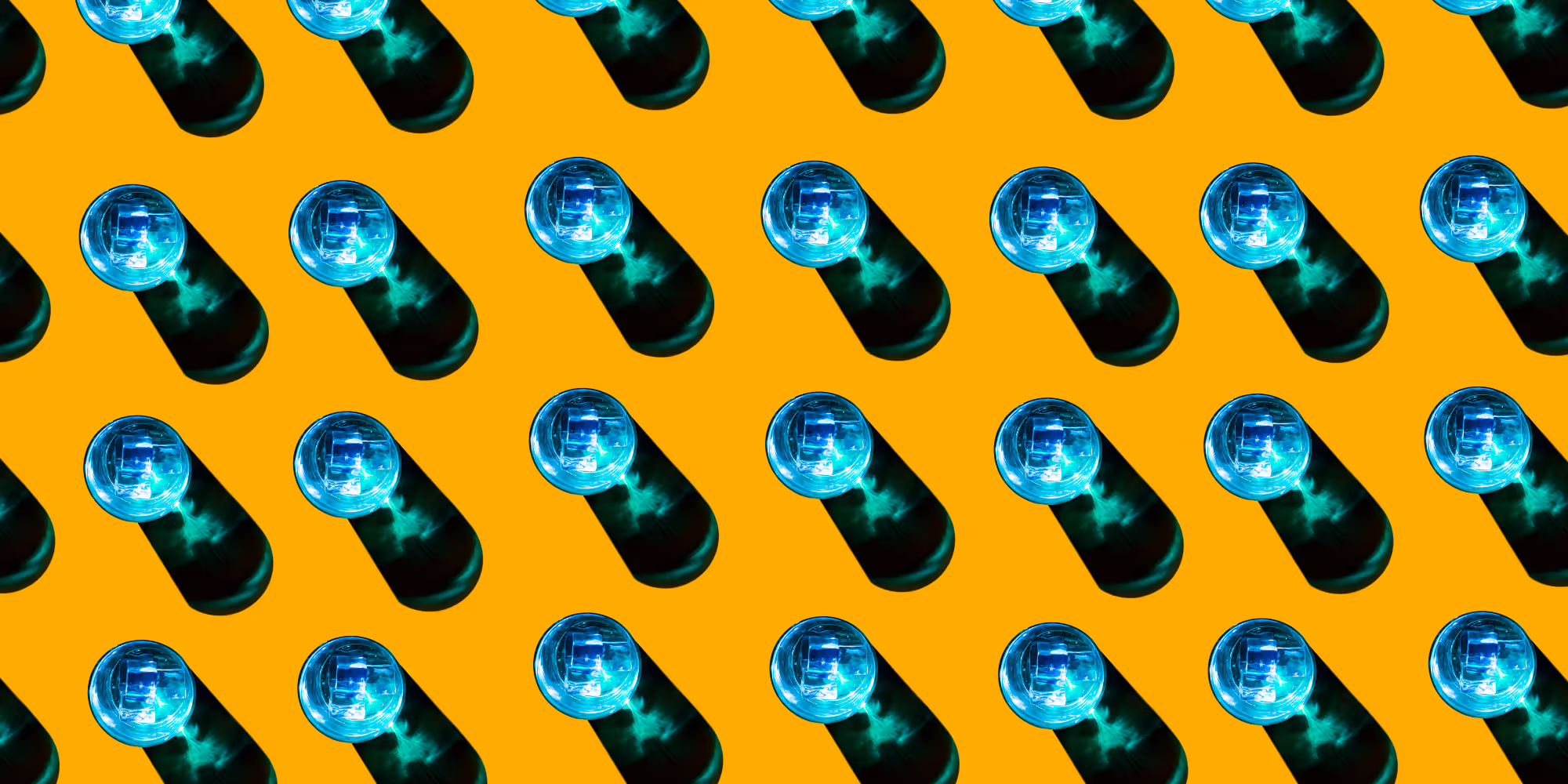 Blue glasses casting a shadow on a yellow background.