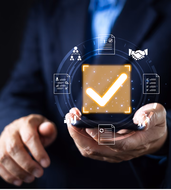 Person holding a smartphone with glowing check mark and business icons floating above the device.