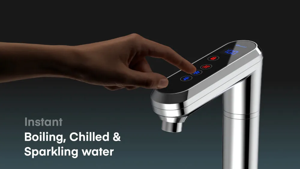 Hand pressing a button on a sleek silver faucet with digital display, offering instant boiling, chilled, and sparkling water.