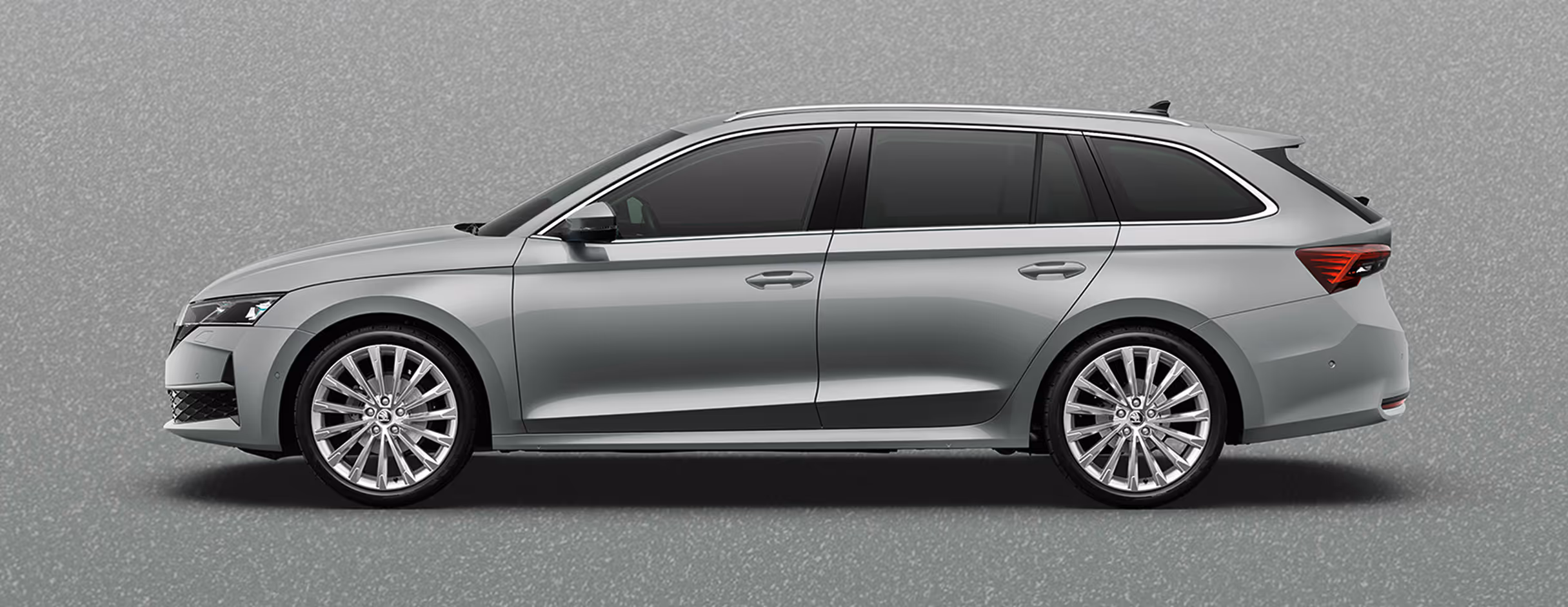 Seitenansicht eines Škoda Elroq in der Farbe Stahl-Grau mit 20 Zoll Leichtmetallfelgen “Vega” vor einem einfarbigen Hintergrund im Farbton der Fahrzeuglackierung.