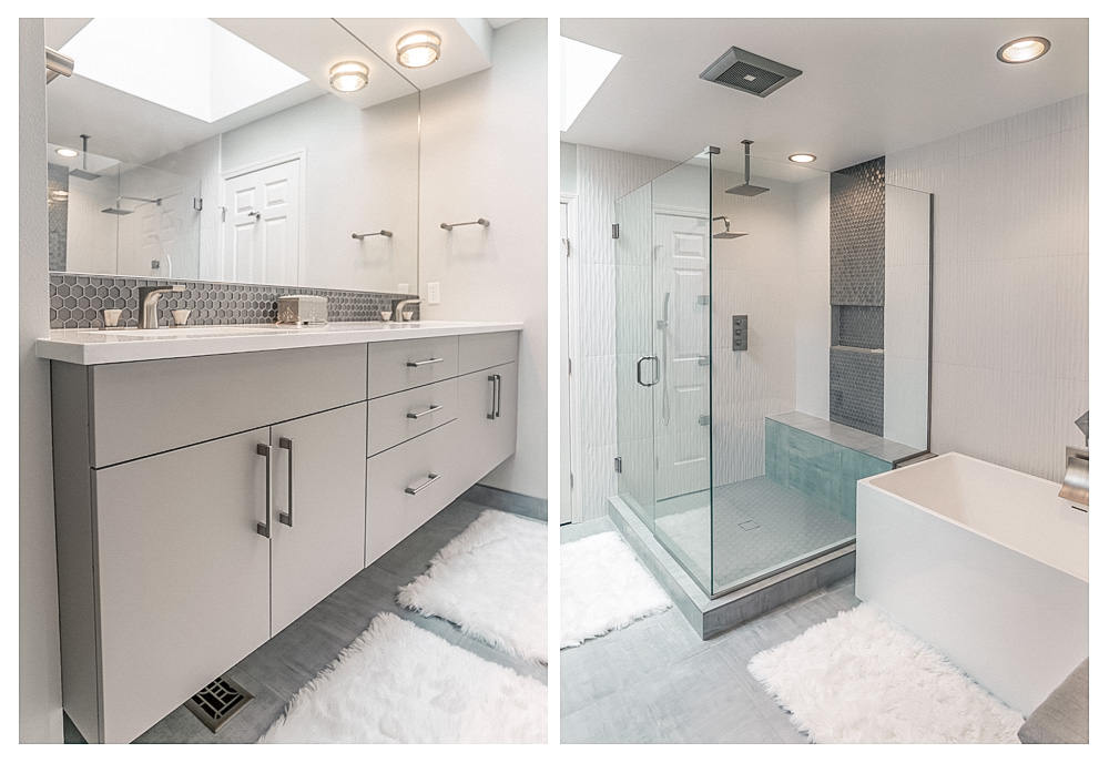 Modern bathroom with gray floating vanity, hexagonal tile backsplash, glass shower enclosure, and a white freestanding bathtub on gray floor with white rugs.