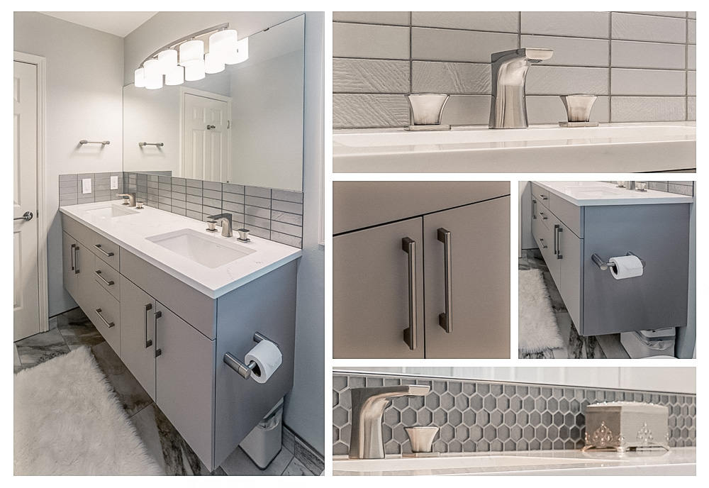 Modern bathroom vanity with double sinks, chrome faucets, gray cabinet doors with handles, a large mirror, and gray tile backsplash.