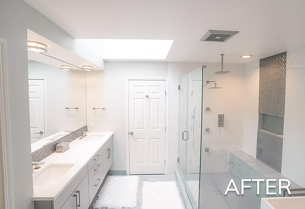 Modern bright bathroom with double vanity, large mirror, glass walk-in shower, and white door.