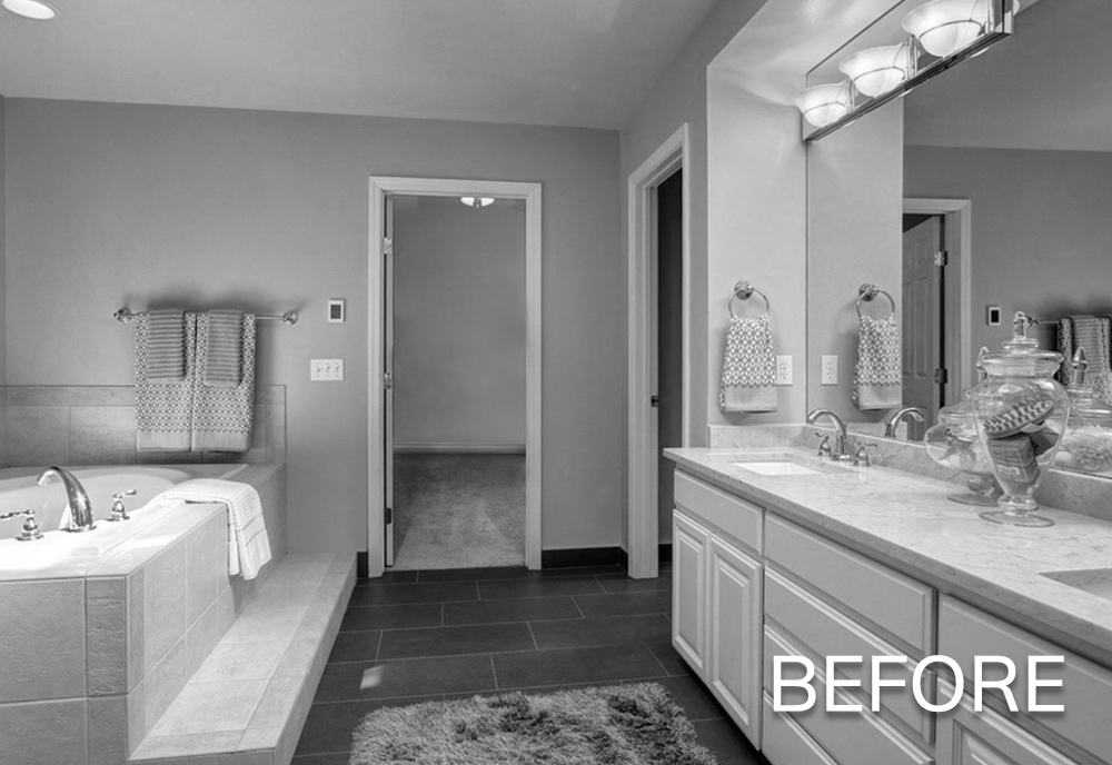 Black and white image of a bathroom with a bathtub, double sink vanity, towels, and a doorway leading to another room, labeled 'BEFORE'.