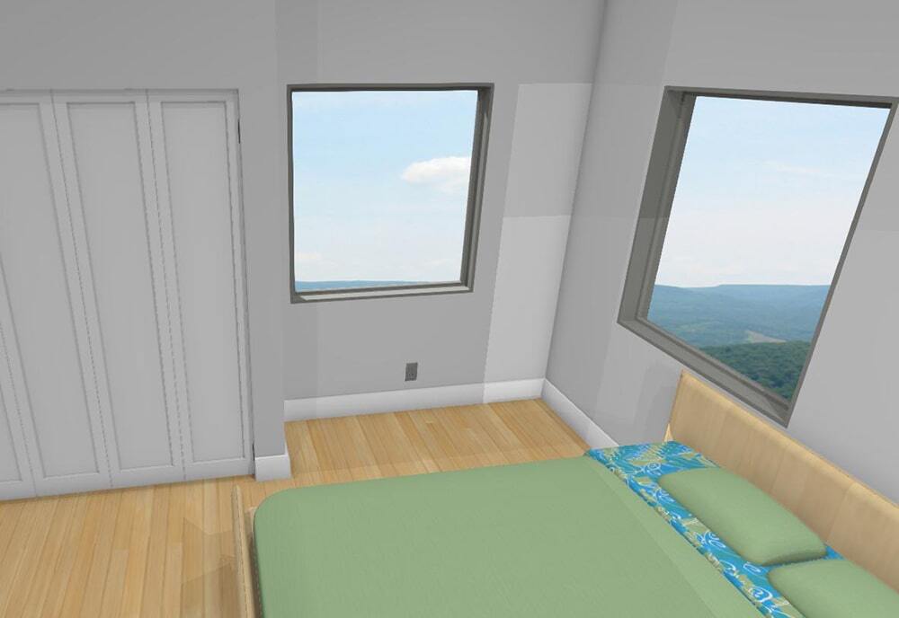Bedroom with light wooden floor, green bedspread on bed, blue floral pillowcases, two windows showing a scenic mountain view, and white closet doors.