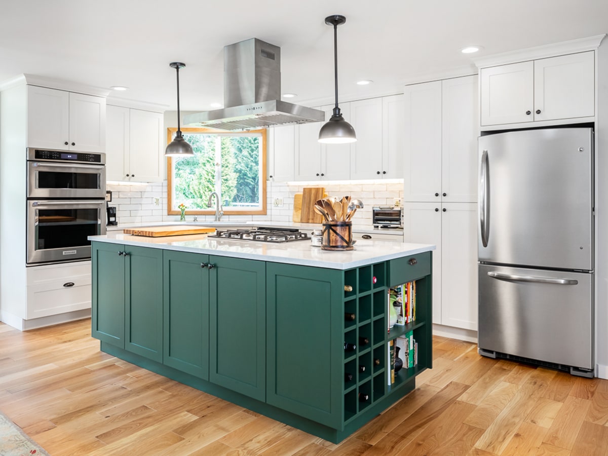 The final result of a green kitchen remodel is a space that blends white with transitional green kitchen cabinets.
