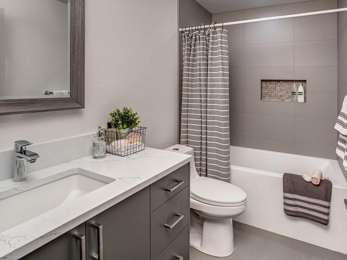 The final result of a green kitchen remodel is a space that blends white with transitional green kitchen cabinets.