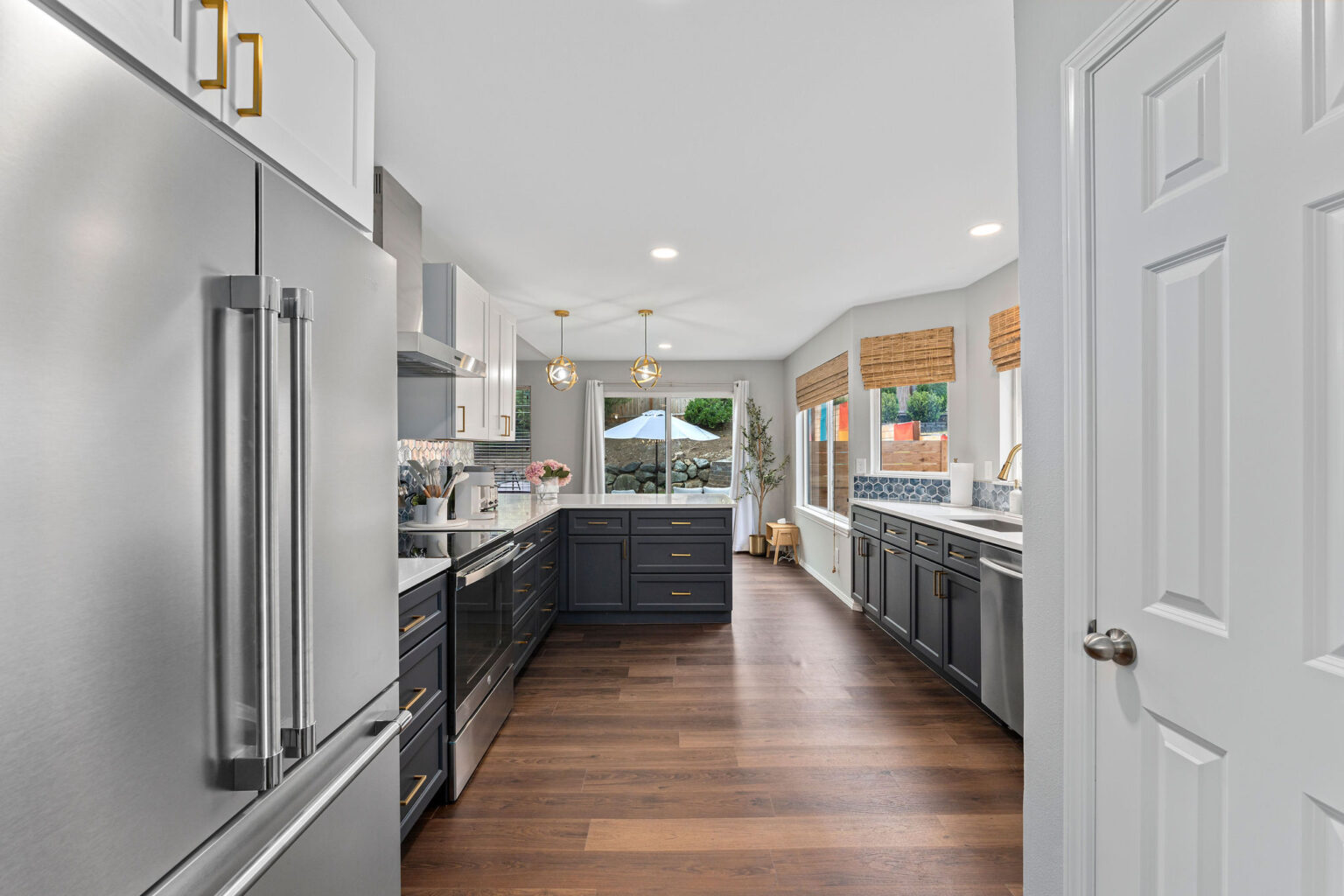 Contemporary galley-style kitchen with two-tone cabinetry