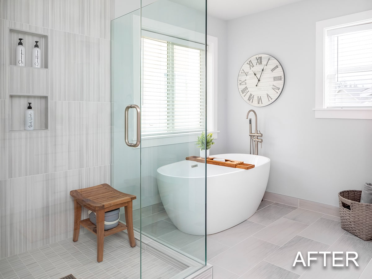 Elegant white kitchen, transitional dark wood floor and brown floor kitchen photo with apron sink, white cabinets, quartz countertops, waterfall slab on the peninsula, light grey backsplash, subway tile backsplash and stainless steel appliances