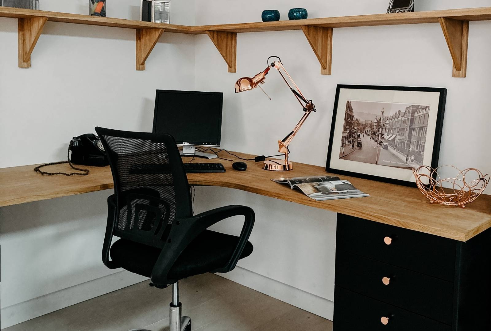 Black Office Rolling Chair Beside Brown Wooden Desk