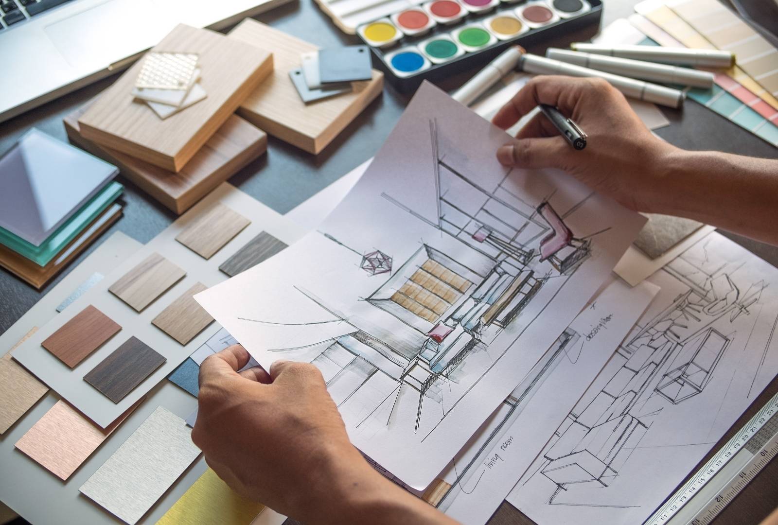 architect designer interior creative working hand drawing sketch plan blue print selection material color samples art tools design studio