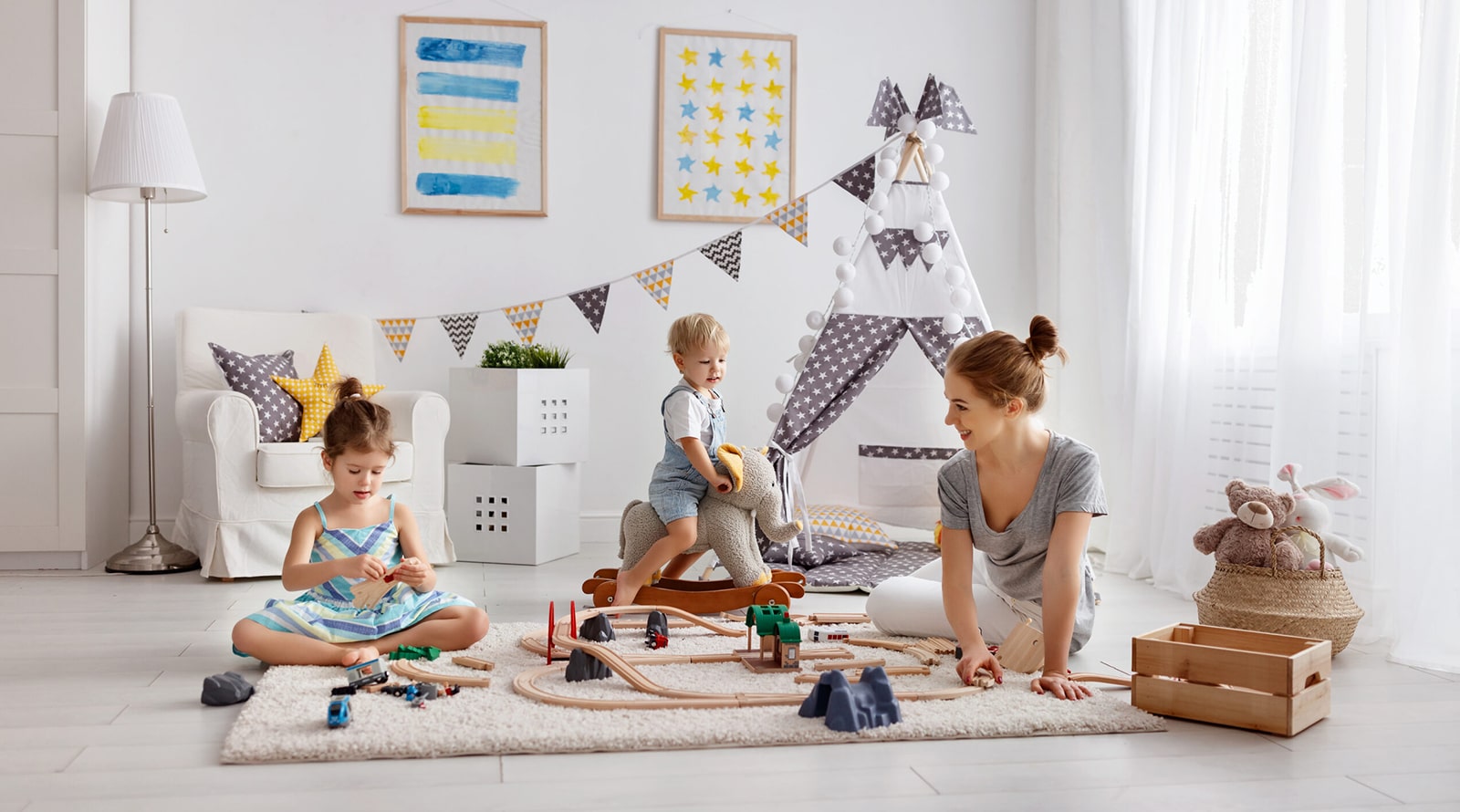 A mom and two children playing together