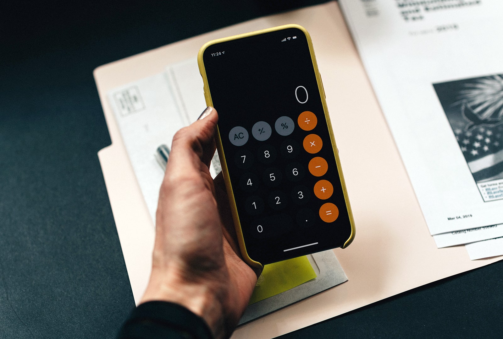 A hand holding a phone