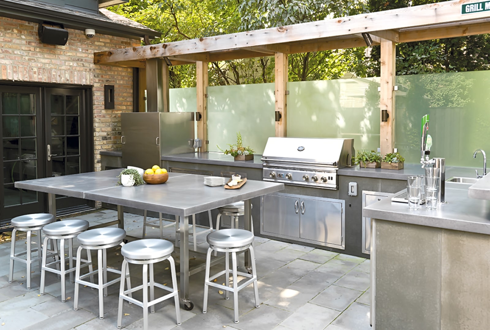 An Outdoor Kitchen with appliances for functional use