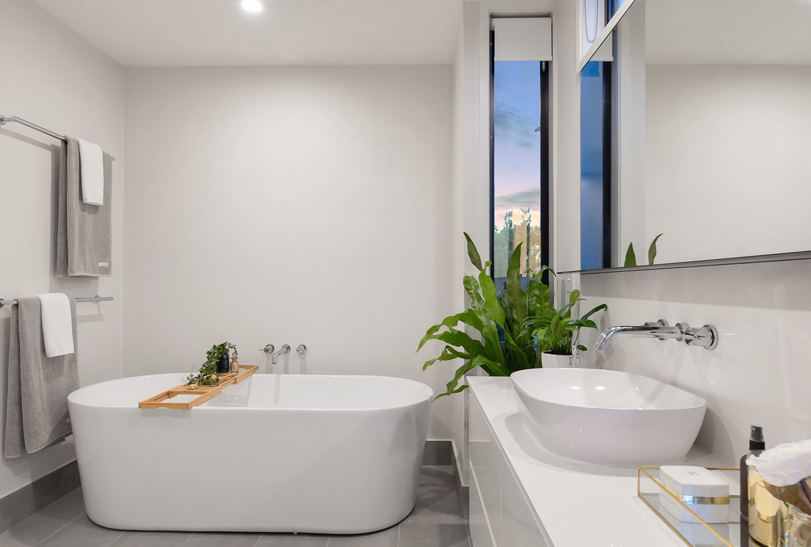 A modern bathroom with a free-standing bathtub.