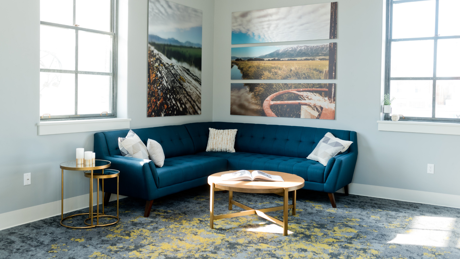 Teal colored sofa with aesthetic corner table