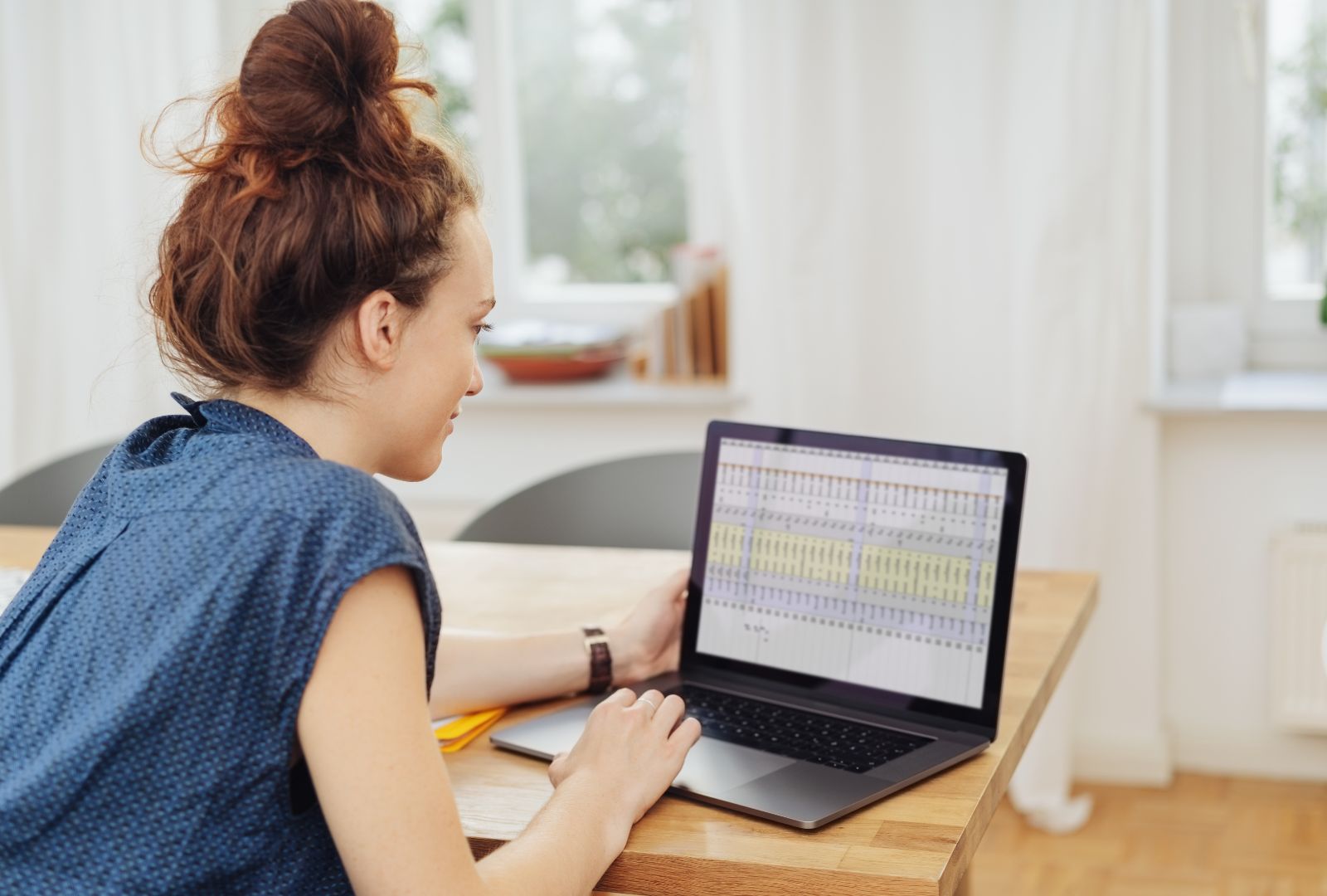 young businesswoman working on a spreadsheet