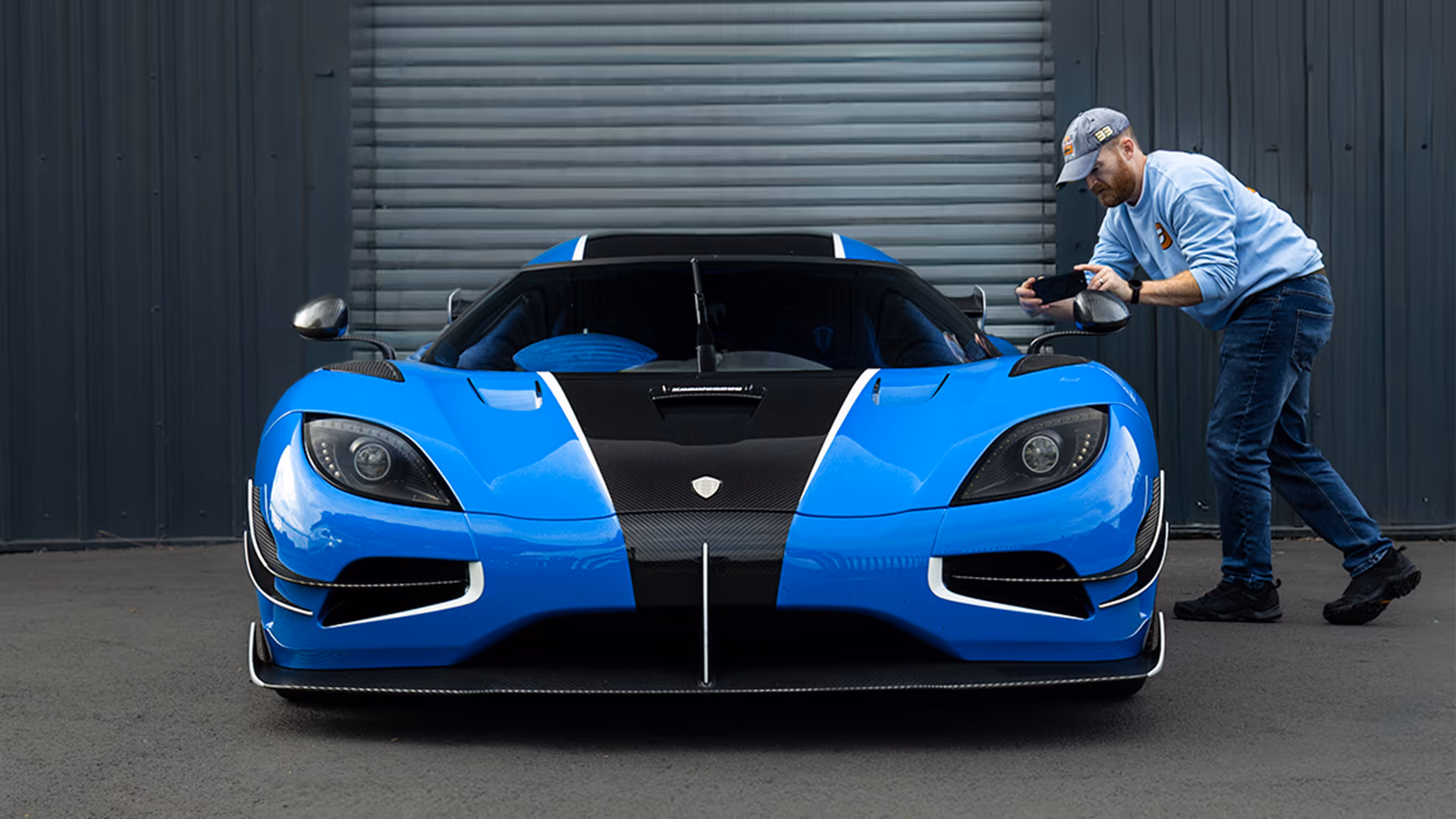 A man uses the Carvatar app to scan a high end sports car and create his Carvatar.