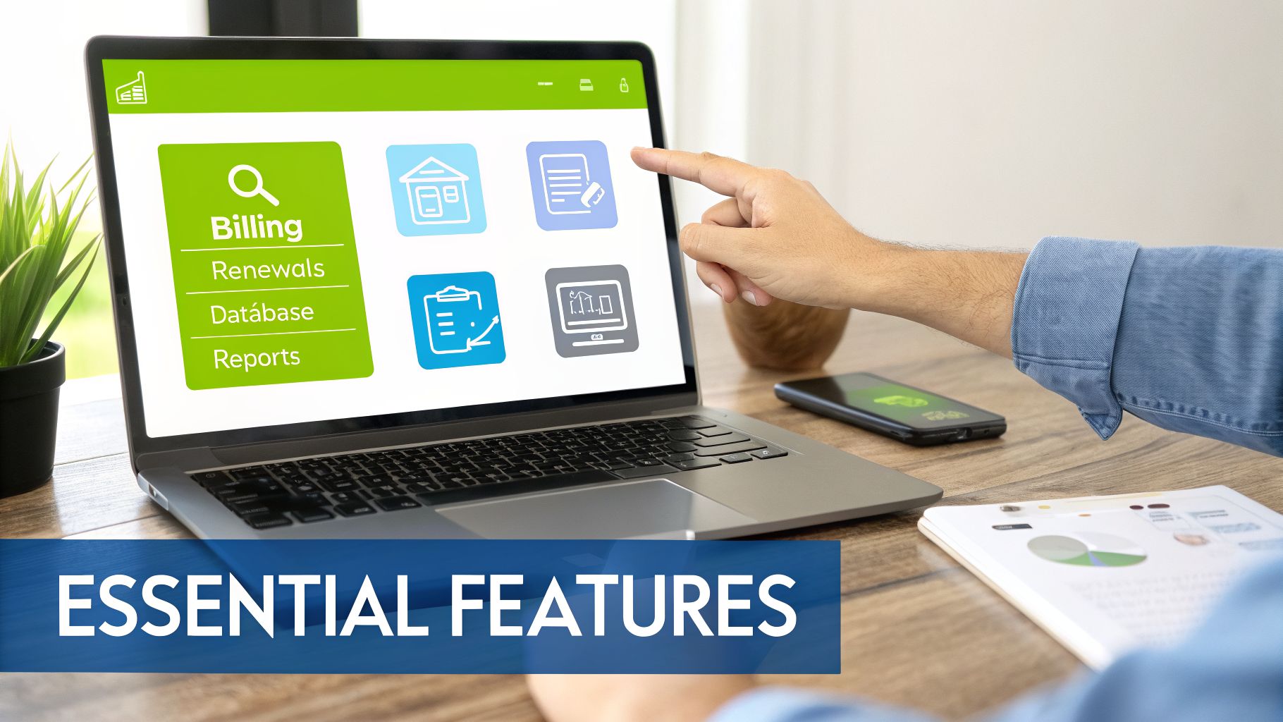 Laptop screen displaying a software dashboard with "Essential Features" like Billing, Renewals, Database, and Reports.