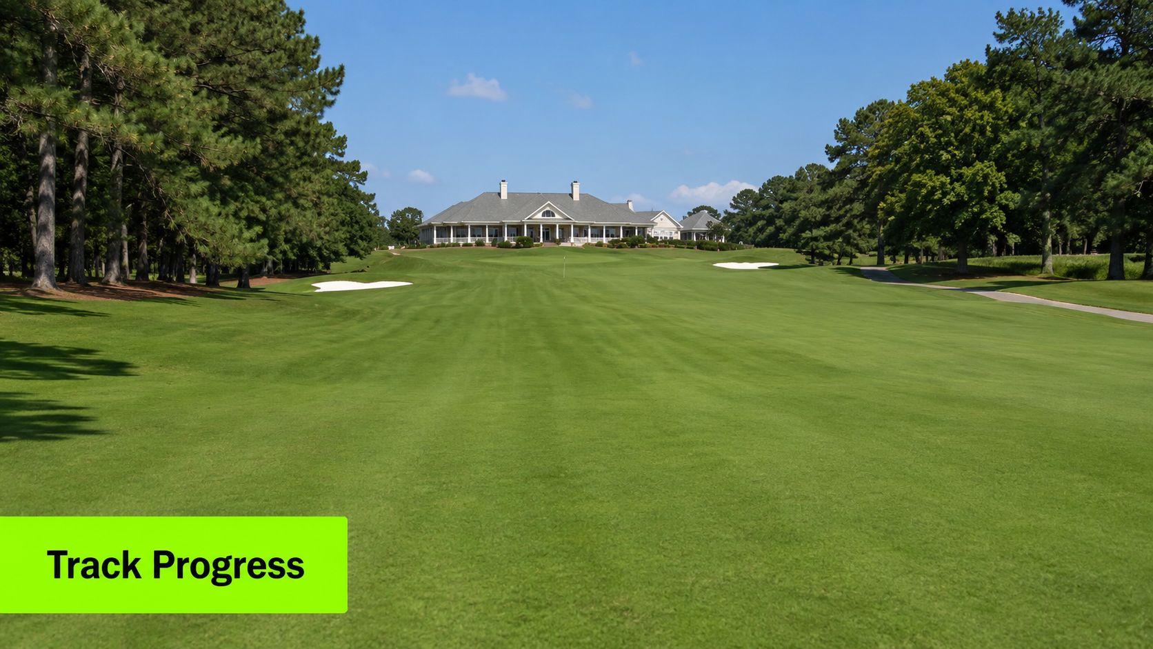 A picturesque view of a pristine golf course fairway leading up to a large clubhouse building.