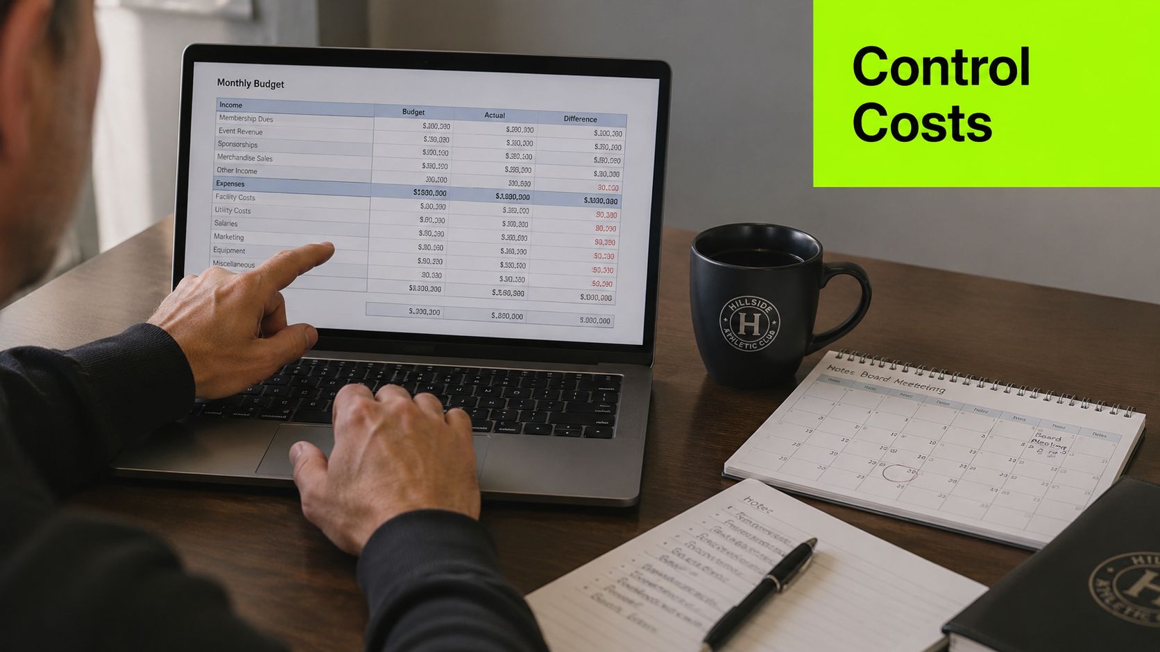 A person analyzing a monthly business budget spreadsheet on a laptop next to notes and coffee.