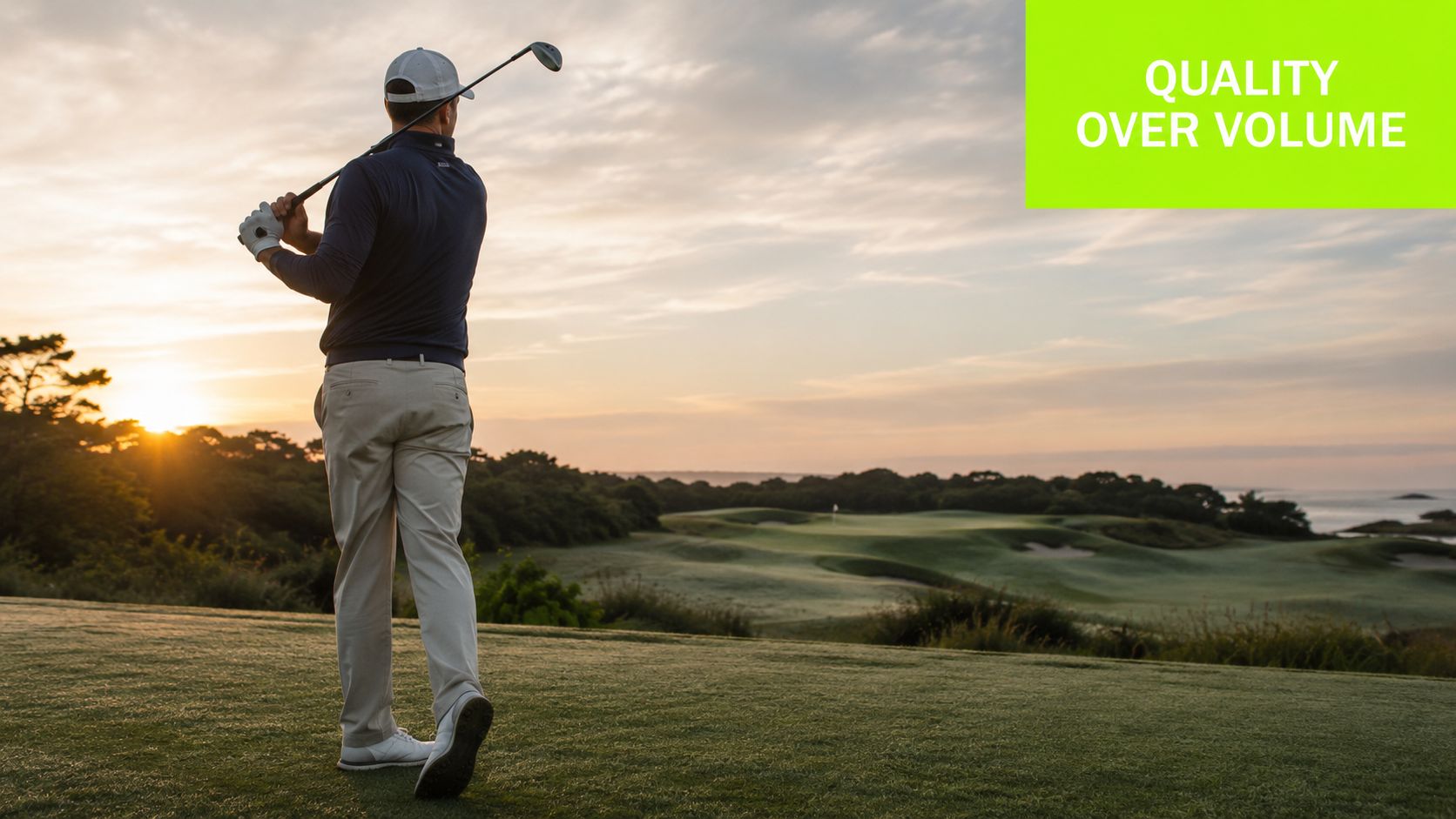 A golfer swinging a club on a scenic golf course during a beautiful sunrise.