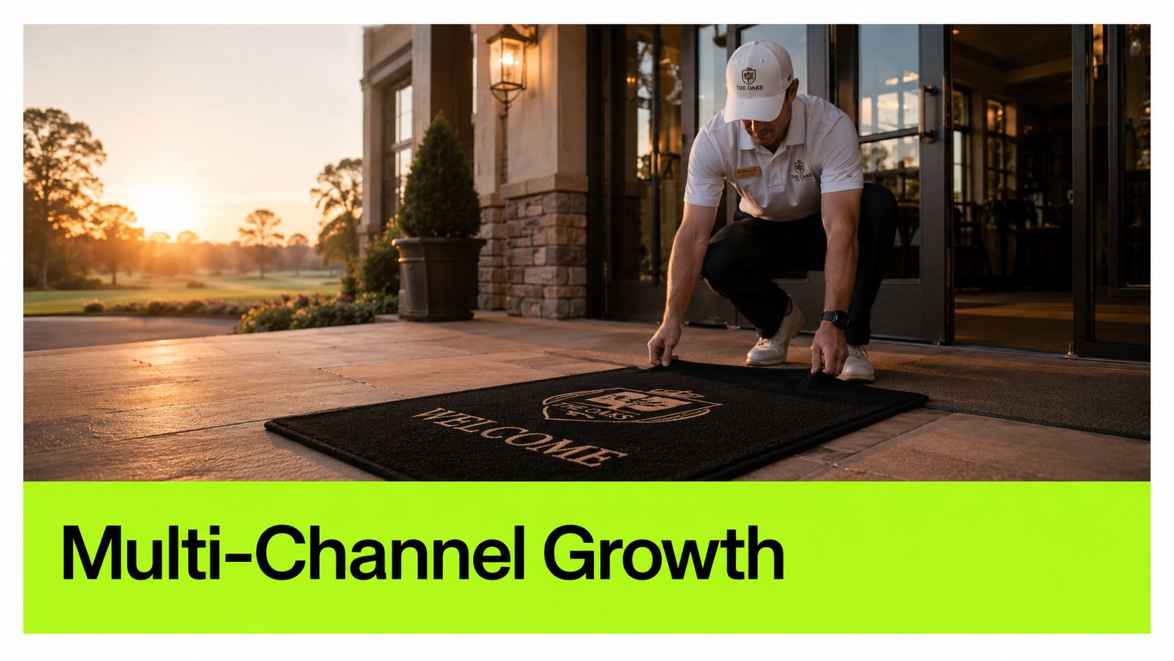A professional staff member placing a branded welcome mat at the entrance of a luxury golf club.