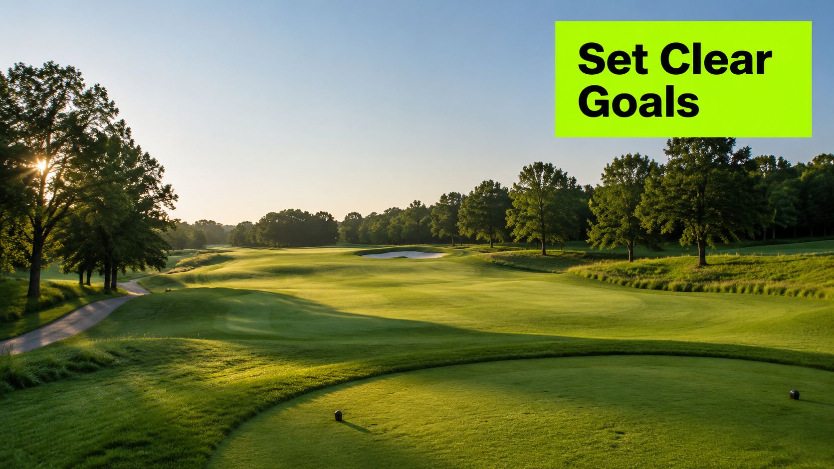A scenic view of a lush green golf course fairway under a bright blue morning sky.