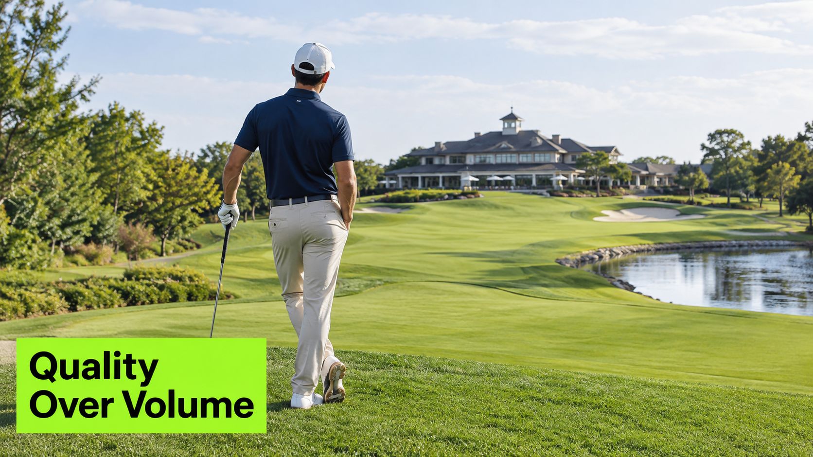 A professional golfer standing on a lush green golf course overlooking a large clubhouse.