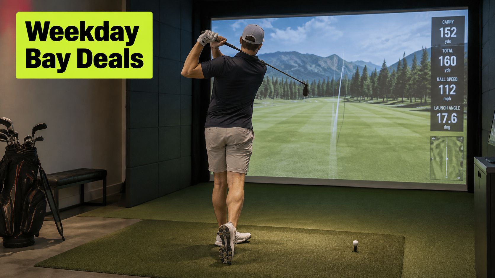 A golfer practicing his swing on a high-tech indoor golf simulator system in a studio environment.