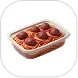 Glass dish filled with spaghetti and meatballs topped with tomato sauce.
