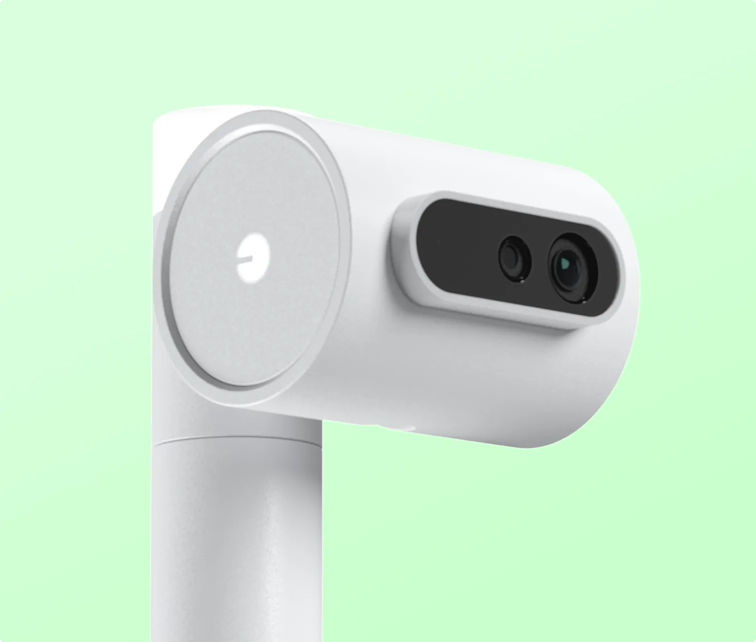 White security camera with dual lenses mounted on a white cylindrical stand against a light green background.