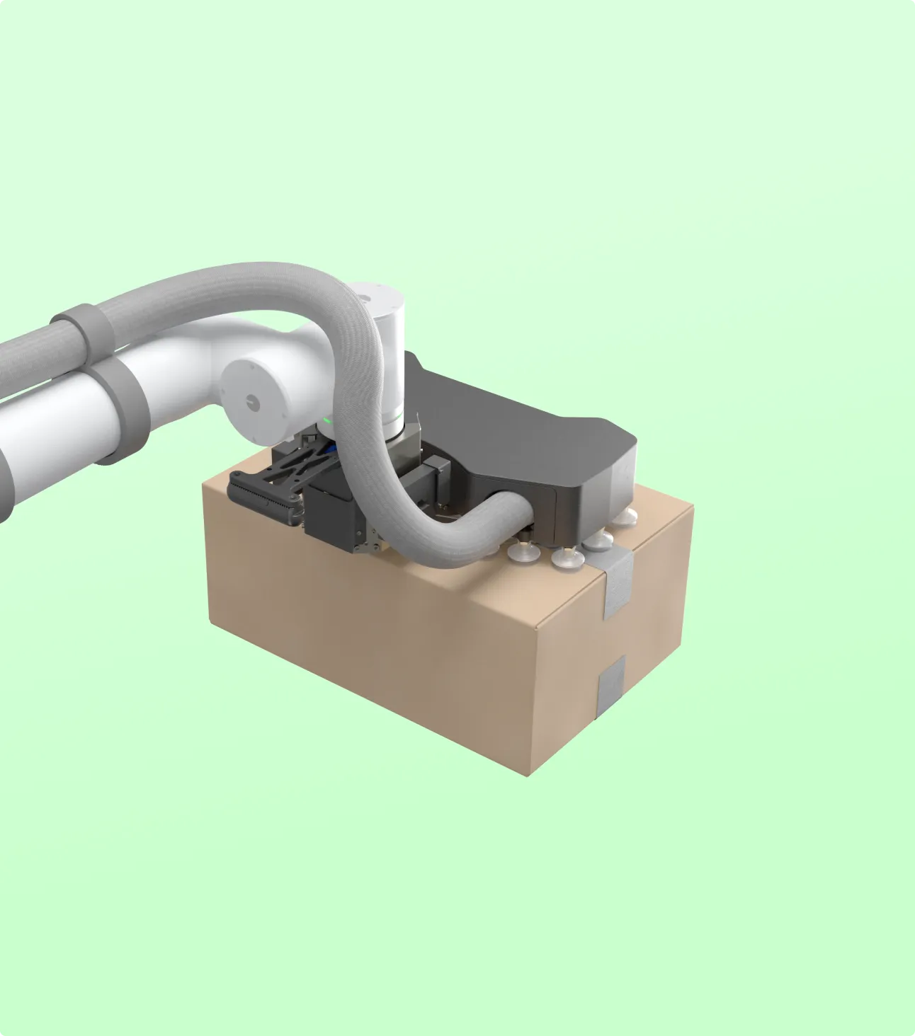 Robotic arm with suction cups lifting a cardboard box against a light green background.