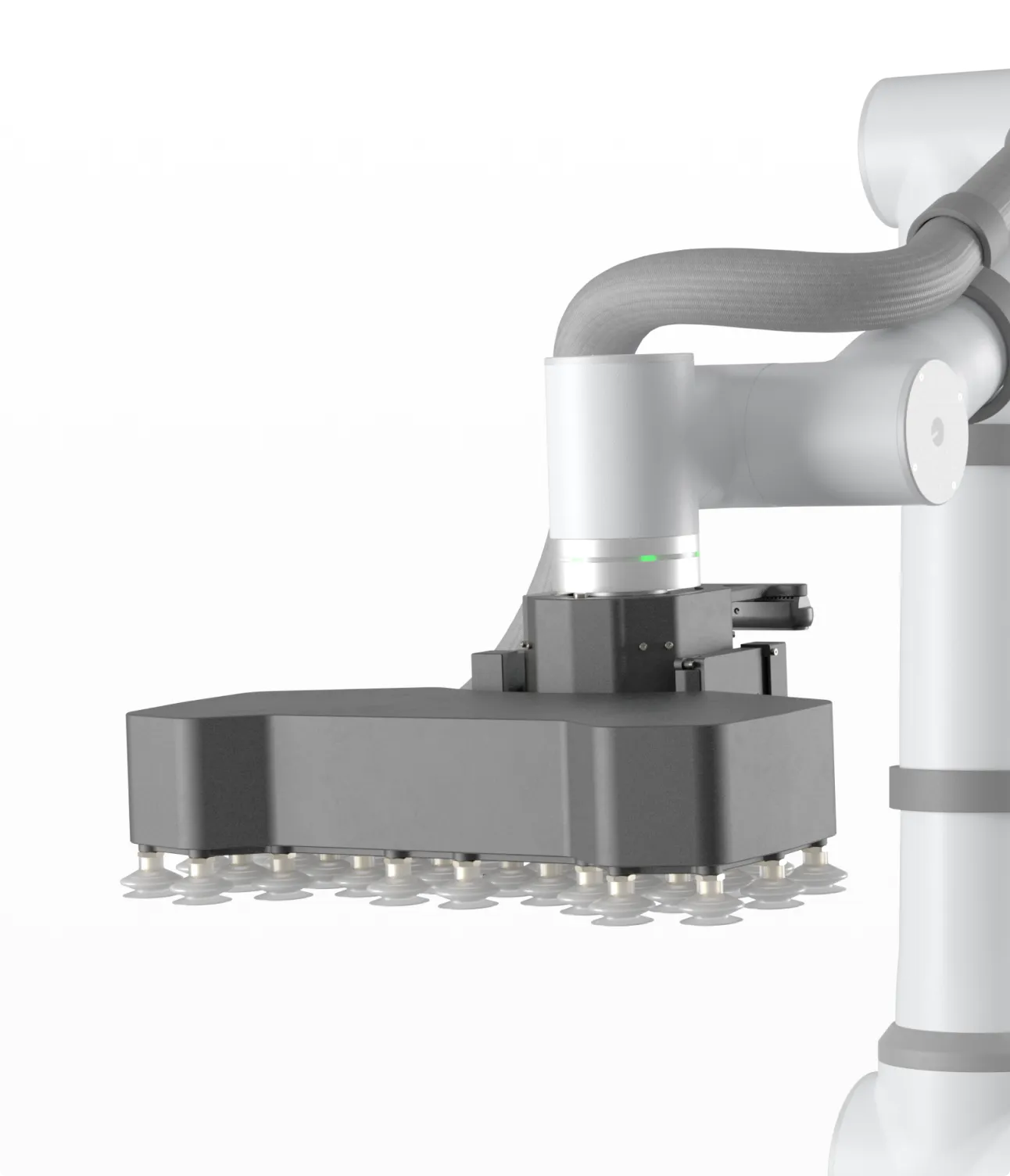 Robotic arm with a wide, black vacuum gripper featuring multiple suction cups.